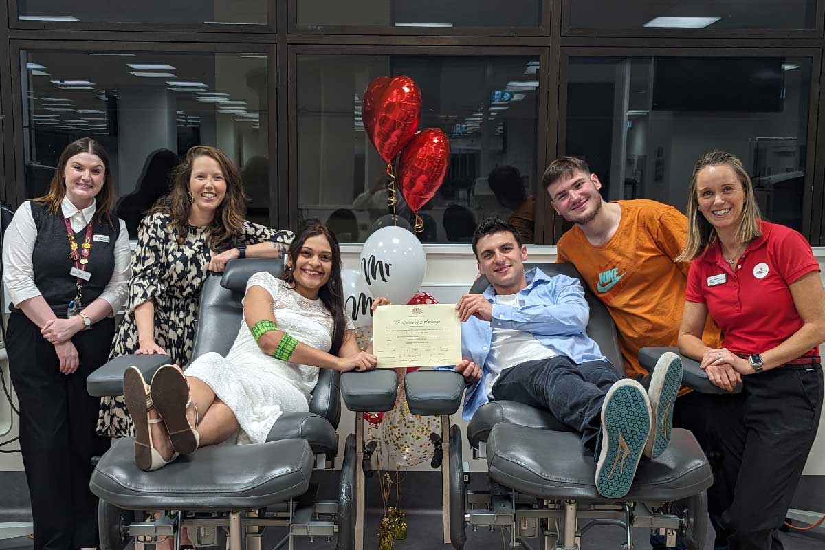 Couple getting married while donating blood at the Australian Red Cross - Life Blood> marriage Celebrant. Simple Ceremonies